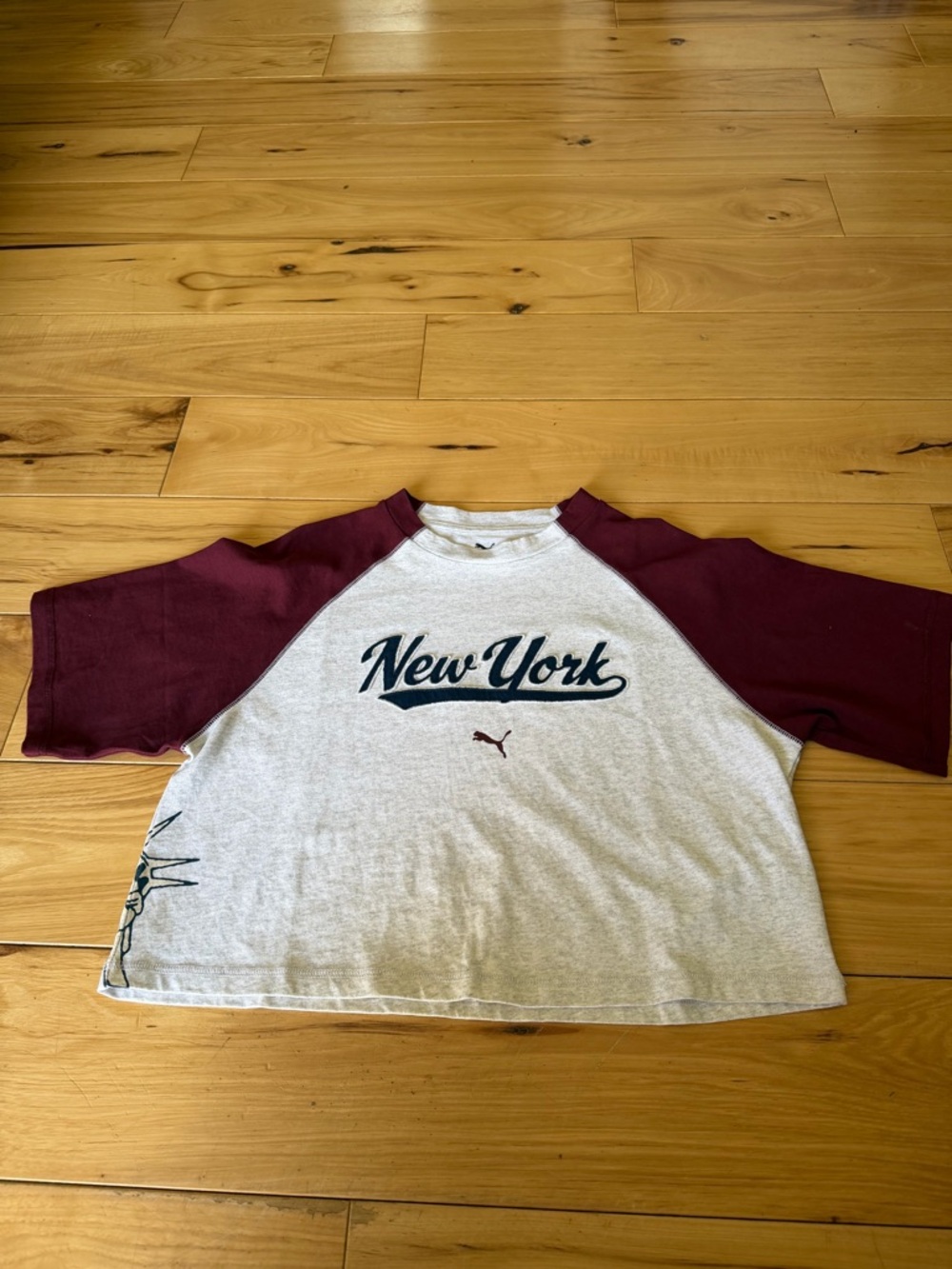 PUMA woman’s New York Raglan Tee in Maroon and Gray